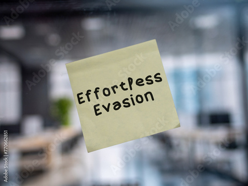 Post note on glass with 'Effortless Evasion'.