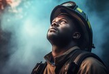 A fireman looks up at the smoky sky
