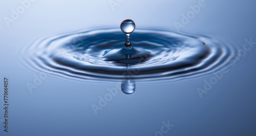 A drop of water is falling into a large body of water