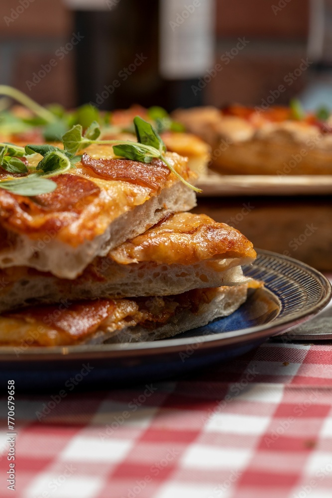 food sitting on top of two plates on a table in front of a bottle food sitting on top of two plates on a table in front of a bottle