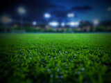 Close ground view of football field at night with blurred stadium background and cool lighting. Generative AI