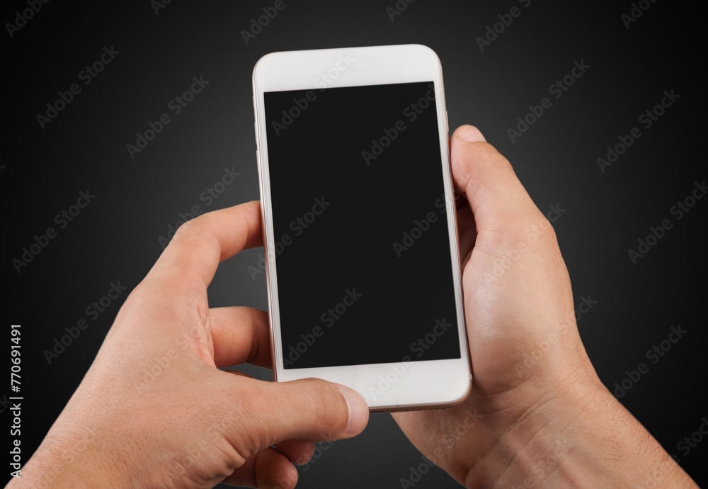 Human hand holding modern smartphone with blank screen. Human hand holding modern smartphone with blank screen.