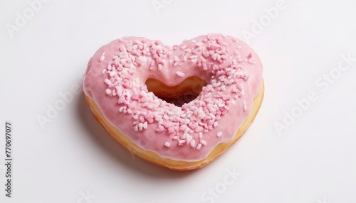 Heart shaped pink donuts with topping isolated on white background