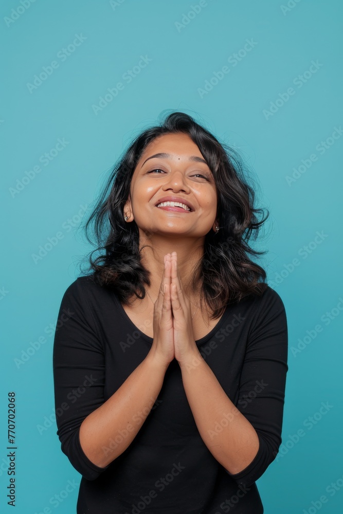 Radiant Elegance: Modern Indian Woman in Front of Light Blue Background generative ai Radiant Elegance: Modern Indian Woman in Front of Light Blue Background generative ai