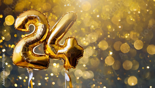 Banner with number 24 golden foil balloon. Twenty four years anniversary celebration. Golden bokeh photo