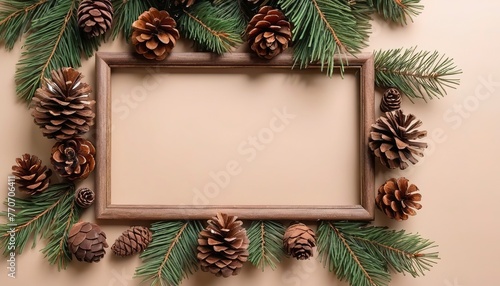 Top view Christmas decoration. Frame of twigs christmas tree, brown natural pine cones with space for text, flat lay