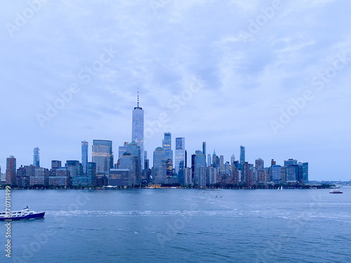 New York City downtown skyline in blues and purples from Jersey City at dusk 