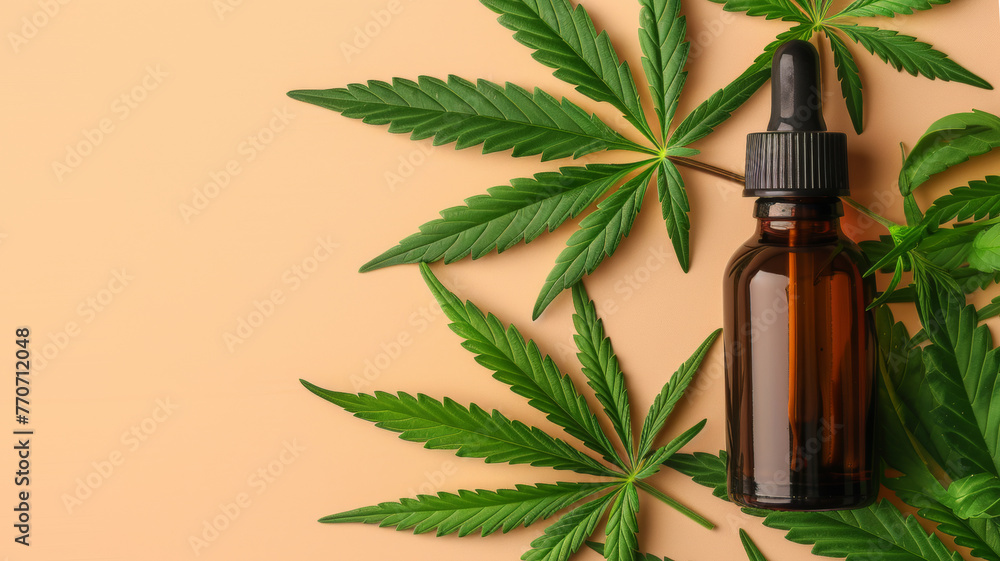 Dark serum bottle with cannabis leaf close up