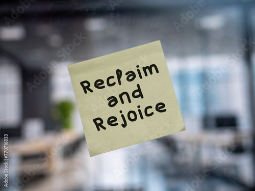Post note on glass with 'Reclaim and Rejoice'.