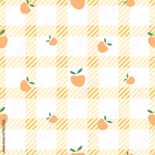 Yellow classic checkered tablecloth texture with peach fruits, background for table cloth textile design