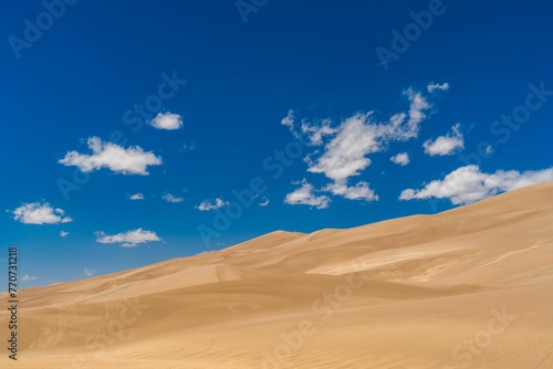 Scenic view of a desert landscape  featuring a rolling sand dune at Great Sand Dunes National Park