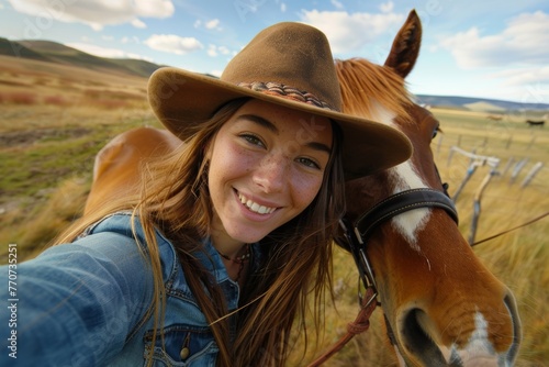 Cowgirl enjoying a selfie with horse on a scenic ranch