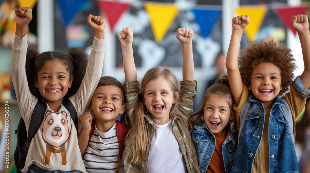 A group of happy children raised their hands in the classroom. back to school concept. A group of happy children raised their hands in the classroom. back to school concept.