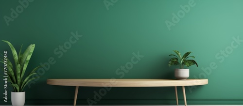 A wooden rectangle table with two houseplants in flowerpots placed on top, set against a green wall for a natural ambiance in the room