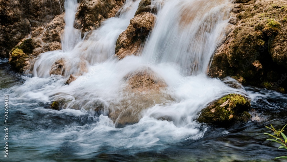 Scenic view of a forest with a waterfall and lake in Jiuzhaigou, Sichuan Province, China. Scenic view of a forest with a waterfall and lake in Jiuzhaigou, Sichuan Province, China.