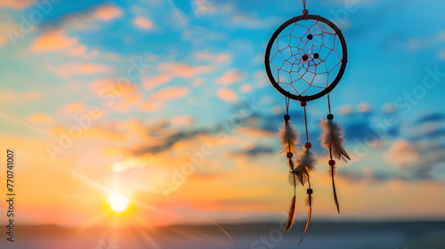 A dream catcher with feathers and a blue background, dreamcatcher hanging against a bright sky backdrop ,Beautiful dream catcher on blue background with lights 