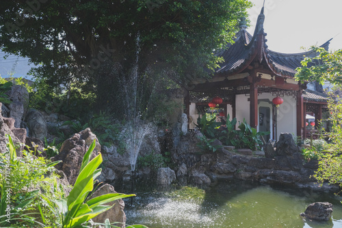 Fukushuen traditional Chinese garden in the Kume area of Naha, Okinawa Japan with pagodas and pavilions with single pond extending into most sections of the garden	 photo