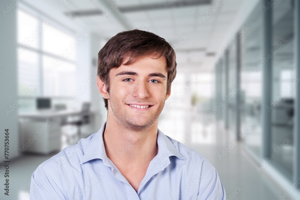 Happy handsome man posing in room Happy handsome man posing in room