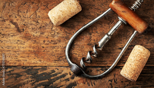 Close-up of an old metallic corkscrew and a wine cork on a wooden table with copy space. Generative Ai.