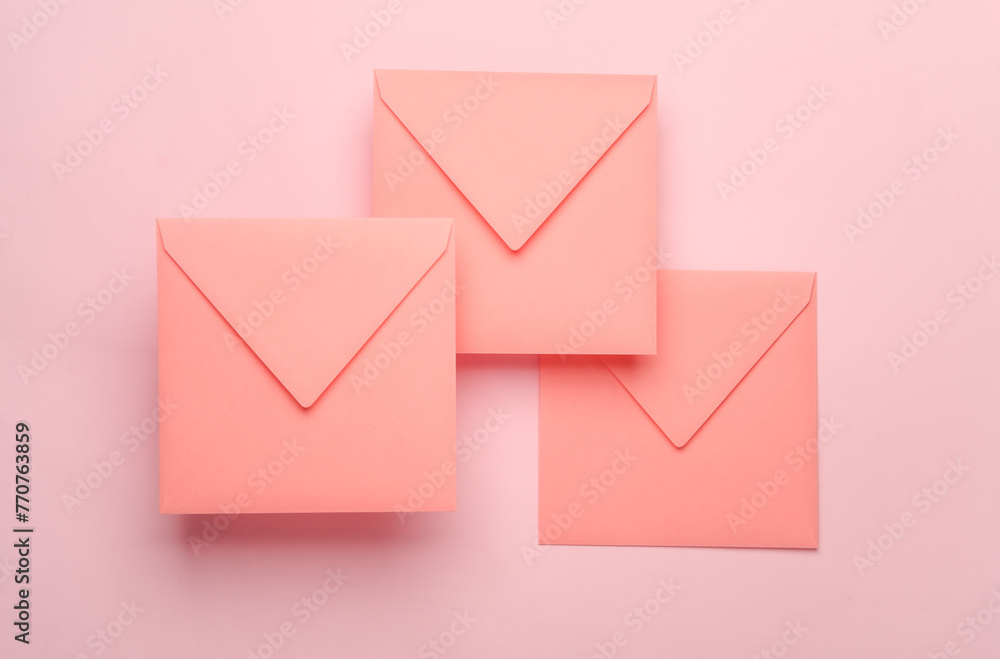 Square paper pink envelopes on pink background Square paper pink envelopes on pink background