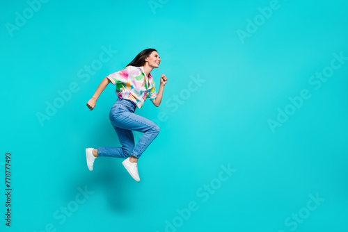 Fototapeta Naklejka Na Ścianę i Meble -  Photo of crazy positive nice woman dressed stylish print clothes look empty space hurry isolated on cyan color background