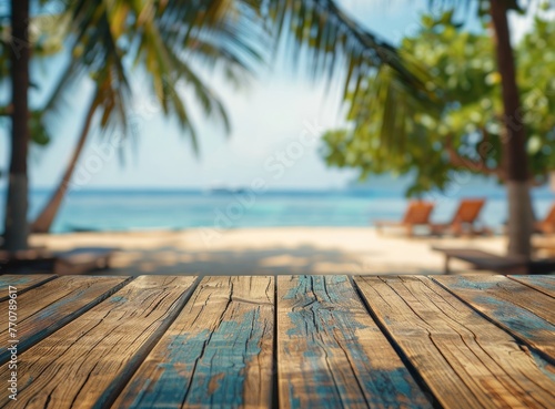 Wooden table with blurred beach in background, nature meets the horizon photo