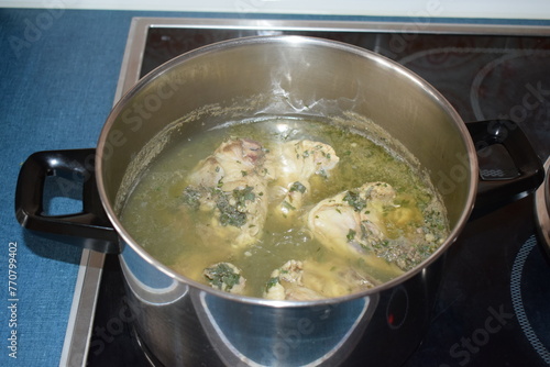 chicken legs cooking in soup