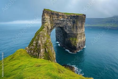 Drangarnir like arch on Faroe Islands in Atlantic ocean landscape with cliff © Тамара Печеная