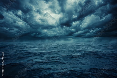 Haunting dark blue sky and sea, gloomy ocean with scary clouds, abstract horror background © furyon