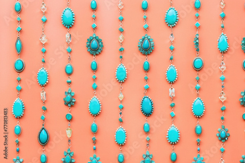 Assorted turquoise beads on string against vibrant orange background for trendy jewelry design concept © SHOTPRIME STUDIO