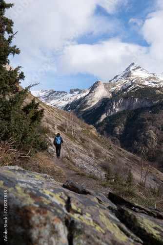 Hiker walking on the path in Pyrenees mountains near Gavarnie  High quality photo