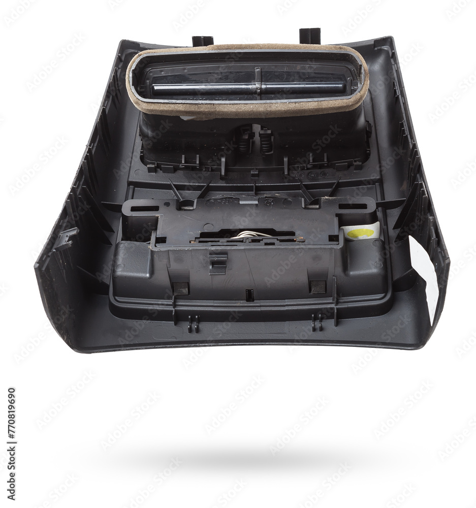 A close-up view of a part of the interior of a modern car with a view of the ventilation deflector of the heater for heating and cooling the rear passenger compartment. Used auto part catalog junkyard A close-up view of a part of the interior of a modern car with a view of the ventilation deflector of the heater for heating and cooling the rear passenger compartment. Used auto part catalog junkyard