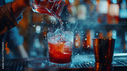 close up of a barman doing cocktail in the bar, barman in the pub, close up o a cocktail on the table