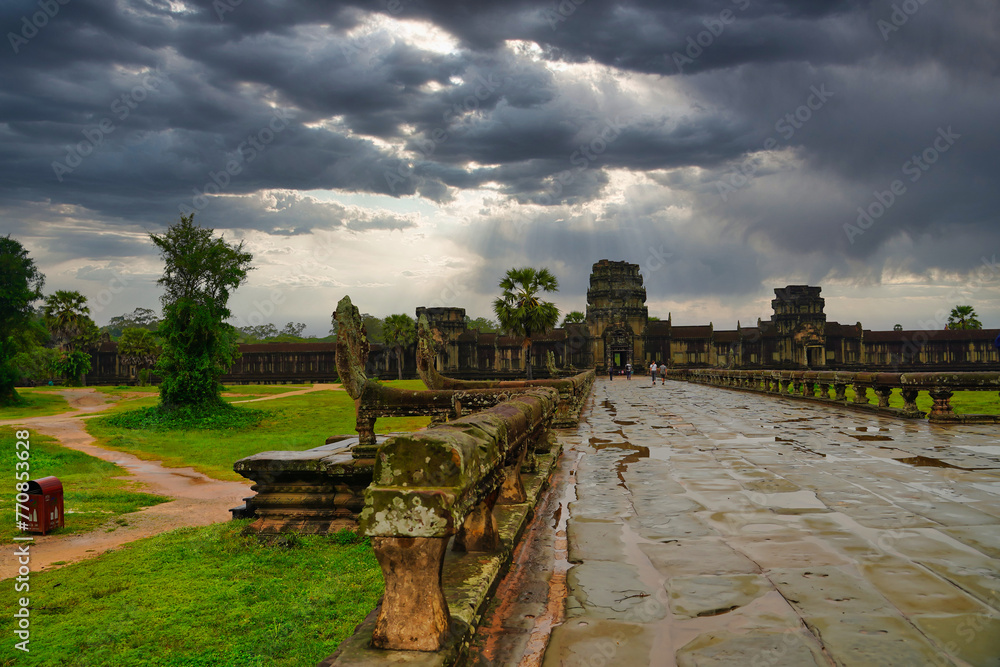 Fototapeta premium Monsoon clouds linger over the Angkor Wat Temple complex at Siem Reap, Cambodia, Asia