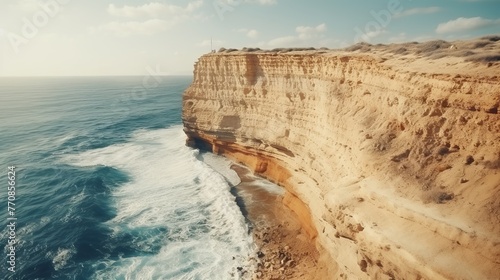 Aerial view of dramatic cliff edge by the sea popular touristic destination for extreme travel