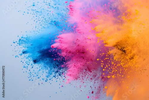 Colored powder explodes in the air vivid colorful abstract background  creativity and Holi festival concept.