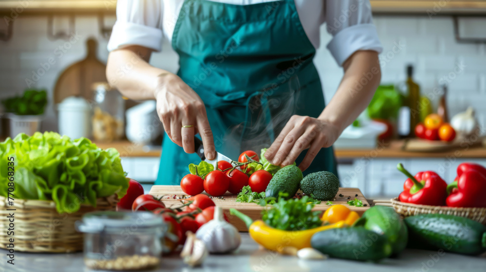 Hands chop garlic on a wooden board among fresh tomatoes and herbs in a sunny kitchen. Hands chop garlic on a wooden board among fresh tomatoes and herbs in a sunny kitchen.