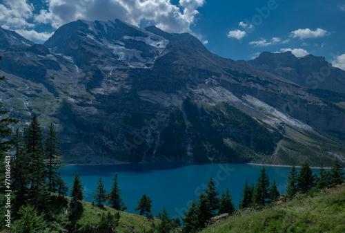 Oeschinensee lake in the Swiss alps on a sunny summer day  Kandersteg