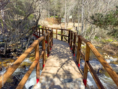 Wooden bridge over the Manzanares river in La Pedriza photo