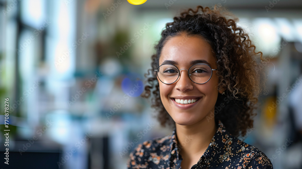 Smiling black young call center employee working during daytime at office desk. Smiling black young call center employee working during daytime at office desk.