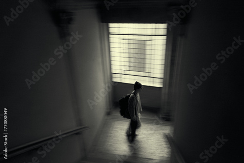 silhouette of a person in a blurry corridor in Lucca italy