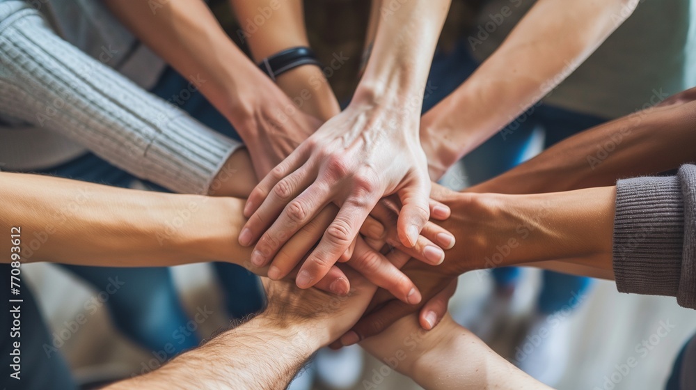 Unity in Diversity: Close-up of Diverse Hands Coming Together in a Symbol of Teamwork and Friendship, with Ample Copy Space. Unity in Diversity: Close-up of Diverse Hands Coming Together in a Symbol of Teamwork and Friendship, with Ample Copy Space.