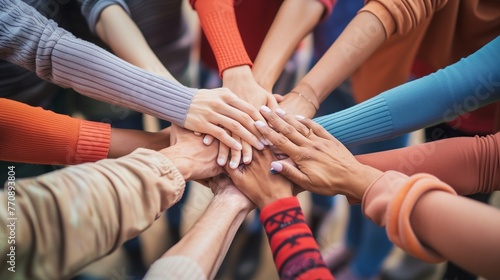 Unity in Diversity: Close-up of Diverse Hands Coming Together in a Symbol of Teamwork and Friendship, with Ample Copy Space.