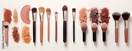 A collection of makeup brushes and tools, Various makeup brushes including highlighters on a beautiful landscape, makeup and beautician concept photo