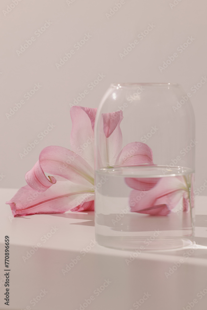 flower behind a vase distorted by water flower behind a vase distorted by water
