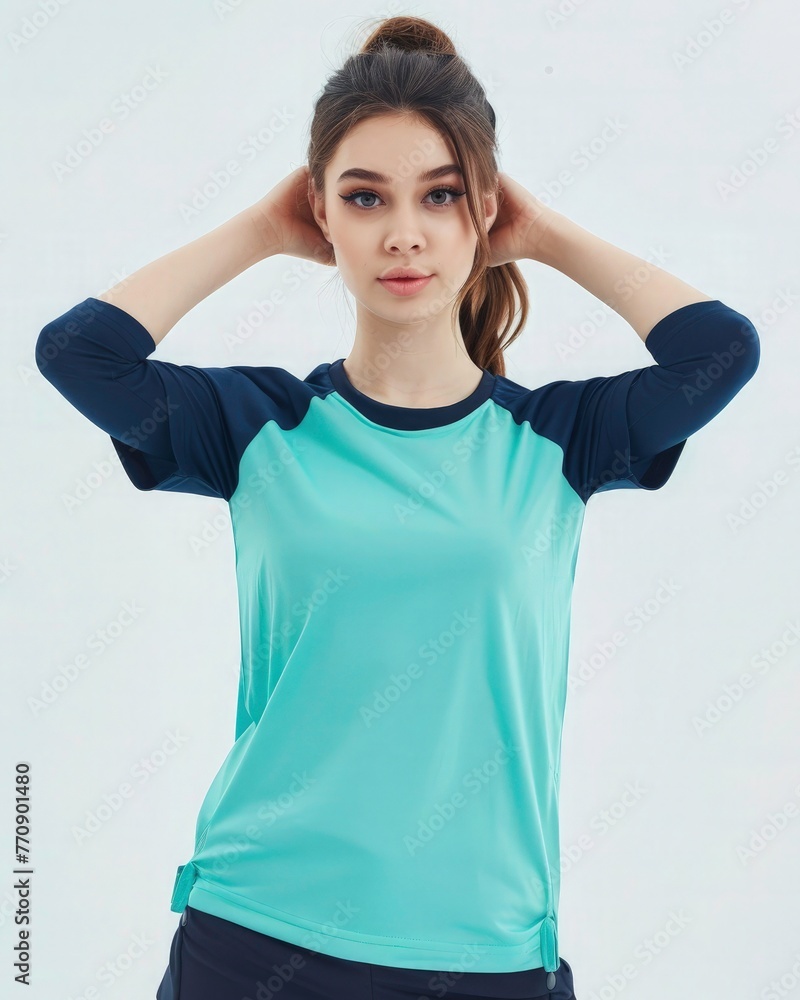 Female t-shirt mockup. A mockup of an athletic young woman. Wearing the turquoise and navy blue color raglan tshirt, front view, white background, studio photography, Female t-shirt mockup. A mockup of an athletic young woman. Wearing the turquoise and navy blue color raglan tshirt, front view, white background, studio photography,