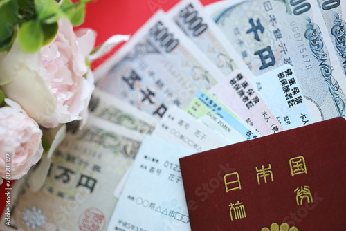 Photography Light blue and red Japan Health Insurance cards on table with japanese residence