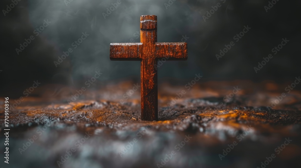   A wooden cross stands solitarily in the open field, smoke rising from behind it against a dark backdrop