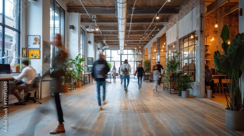 Bright business workplace with people in walking in blurred motion in modern office space © 2D_Jungle
