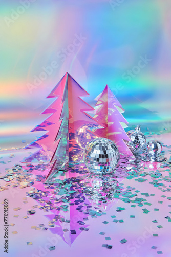 ?hristmas trees of holographic foil with disco balls and confetti photo